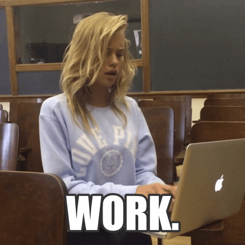 Video gif. Blonde woman typing on an Apple laptop in a college lecture room. White block text reads “Work.”