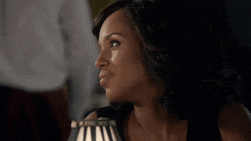 TV gif. Kerry Washington as Olivia on Scandal smiles curtly to the side, then faces forward and leans back in her chair, looking deeply annoyed.