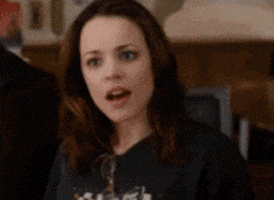 Celebrity gif. Rachel McAdams as Amy Stone in The Family Stone approaches someone and looks earnest as she signs, "I love you," while also mouthing it.