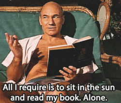 Gif of Patrick Stewart lying on a sun lounger holding a book, saying: "All I require is to sit in the sun and read my book. Alone."