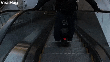 Escalator Mishap On An Electric Unicycle GIF by ViralHog