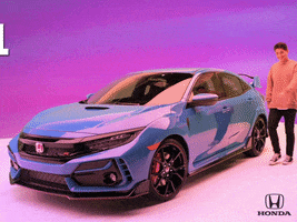 Ad gif. Young smiling man gets into a blue Honda Civic Type R, and text slides across the screen, reading "let's roll."