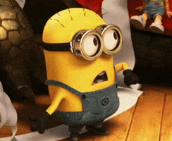 Movie gif. A surprised Minion from Despicable Me turns away, lowers its arms, and looks around with a shout. Text, "What?!!"