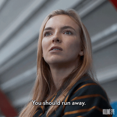 TV gif. Jodie Comer as Villanelle in Killing Eve. She stares someone down intimidatingly, scowling as she says, "You should run away." 