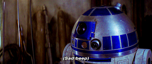R2D2 from star wars with the subtitles 'sad beep' so we can infer the sound that they are making