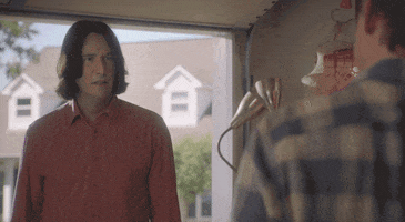 Movie gif. Actor Keanu Reeves as Ted Logan in Bill and Ted Face the Music stands in his garage and dejectedly says "I'm tired dude."