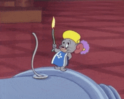 Cartoon gif. Jerry the mouse grins as he lights a fuse. It quickly burns and then explodes in a cloud of smoke. 