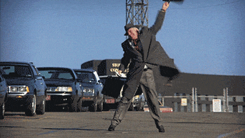 Movie gif. Steve Martin as Neal Page from Planes, Trains, and Automobiles throws a fit in the middle of a parking lot.