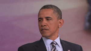 Politics gif. Barack Obama with his head turned to the side, looking blank but serious and blinking his eyes.