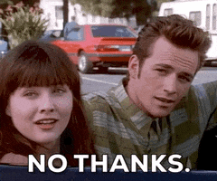 TV gif. Luke Perry as Dylan and Shannen Doherty as Brenda in Beverly Hills, 90210, sit in a car as Dylan shakes his head like he's not interested and gives a smug, "No thanks."