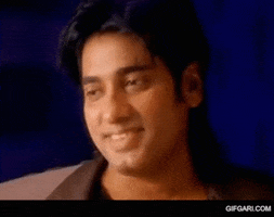 Celebrity gif. Ananta Jalil nods his head while smiling gently.