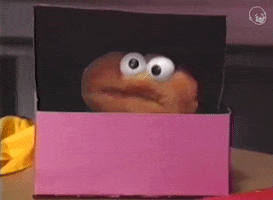 Video gif. A googly-eyed donut puppet peeks out of a pastry box to say: Text, "Hey, that's good!"