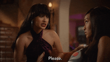 TV gif. Francia Raisa as Ana Torres in Grown-ish. Dressed up like singer Selena\ looks pleadingly over at another woman as she brings her hands up into the prayer position and says, "Please."