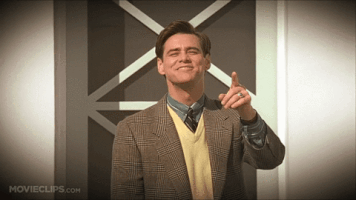 Movie gif. Actor Jim Carrey as Truman Burbank in The Truman Show points and recoils in laughter.