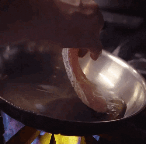 chowhound cooking fish seafood sizzle GIF