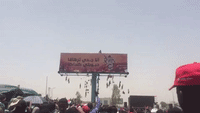 Billboard Bearing Image of Chanting Sudanese Woman Appears Outside Khartoum Military HQ