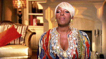 Reality TV gif. In a confessional, Nene Leakes from Real Housewives waves to the camera and sassily says, "Bye!" which appears as text, shutting her eyes and pursing her lips.