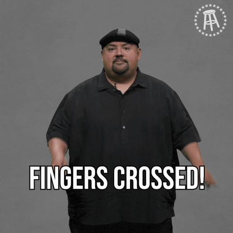 Celebrity gif. Gabriel Iglesias on the Youtube channel Answer the Internet, looks at us and holds both of his hands up with fingers crossed, saying, "Fingers crossed!"