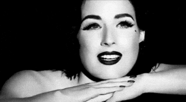 dita von teese wink GIF