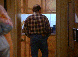 Seinfeld gif. Jason Alexander as George walks into a kitchen then turns around, noticing smoke, and yells "Fire!" He races past children and elders to the front door.