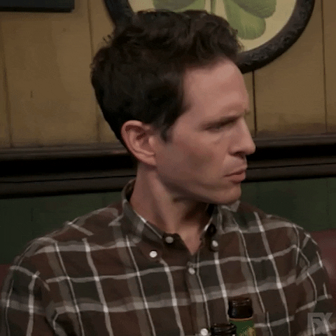 TV gif. Glenn Howerton as Dennis in It's Always Sunny in Philadelphia turns his head and rolls his eyes as if he were uncomfortable. 