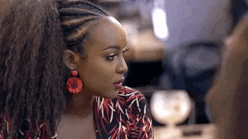 Reality TV gif. Amara La Negra, on Love and Hip Hop, swings her head from the side and rolls her eyes dramatically.