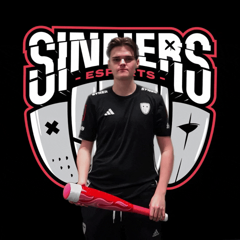 Sports gif. A man wearing a Sinners Esports jersey stands in front of a large Sinners Esports logo. He holds a toy bat and gives us the middle finger with a straight face. 