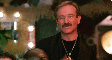 Movie gif. Robin Williams as Armand in The Birdcage smiles kindly and blows a kiss at us.