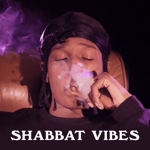 Video gif. Young man reclining smoking a joint. Text, "Shabbat vibes."