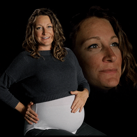 Video gif. Amanda rubs her pregnant belly with a slight exhale and sweet smile. Behind this, Amanda's face is superimposed on a black background, giving a heavy sigh complete with rippling lips and an eye roll towards us.
