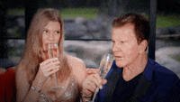 Two people sipping champagne