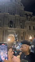 Eagles Fans Scale Poles Outside Philadelphia City Hall Following Super Bowl Loss