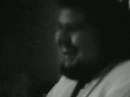 Music video gif. Black and white footage of the Beastie Boys’ Off the Grid music video shows two bad members in the studio clapping to the beat.
