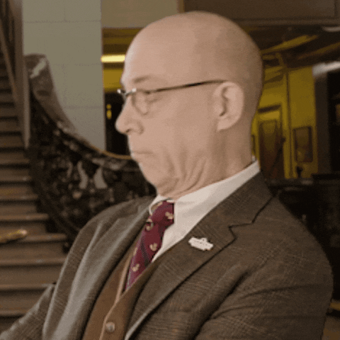 Celebrity gif. JK Simmons as Professor Burke in the Farmers Insurance commercials frowns toward the camera and nods his head in agreement.