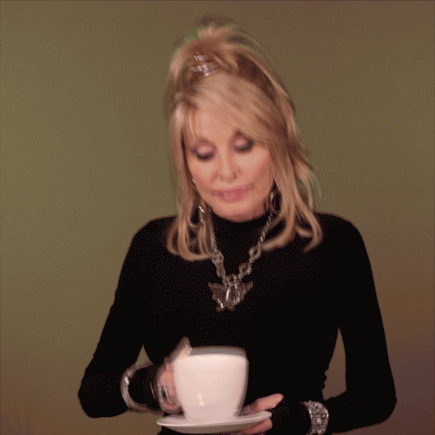 Gif of Dolly Parton sipping tea and winking