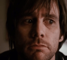 Movie gif. Jim Carrey as Joel in Eternal Sunshine of the Spotless Mind appears confused, frowning and squinting while his eyes dart around.