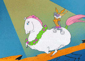 Cartoon gif. Bugs Bunny, dressed as a sexy Brünnhilde, rides atop an enormous, girly horse running with all her might.