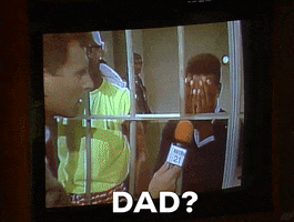 TV gif. A TV screen with a news recording of Alfonso Ribeiro as Carlton Banks on Fresh Prince of Bel-Air. He stands in a jail cell, leaning on the door. He uncovers his face and reveals his pleading, sorrowful face. He cries into the microphone, “Dad?”