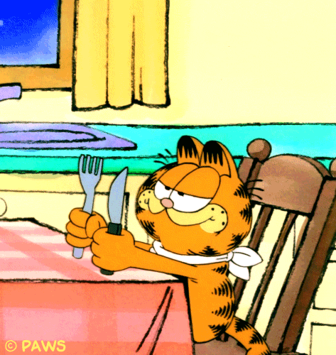 Cartoon gif. Garfield sits in a chair at a kitchen table. He has a napkin tied around his neck and bangs a fork and knife onto the table.