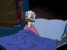 Disney gif. Donald Duck sits up in bed with half open eyes. He closes them as goes to lay back down and pulls the covers over him to hide. 
