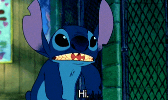 Cartoon gif. Stitch from Lilo and Stitch lowers his long ears, squinting his eyes in an attempt to be friendly. He reaches his hand out like a baby would do to wave hello. He says, “Hi,” over pronouncing each syllable, and then gives a big sharp toothed grin.