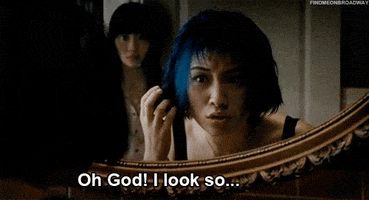 Movie gif. Ellen Wong as Knives in Scott Pilgrim Versus the World looks in the mirror as she touches the ends of her hair in awe and says, "Oh God! I look so. Good!"