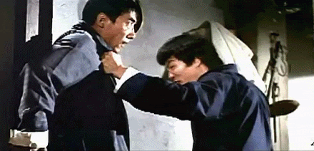 bruce lee punching the shit out of yo solar p GIF