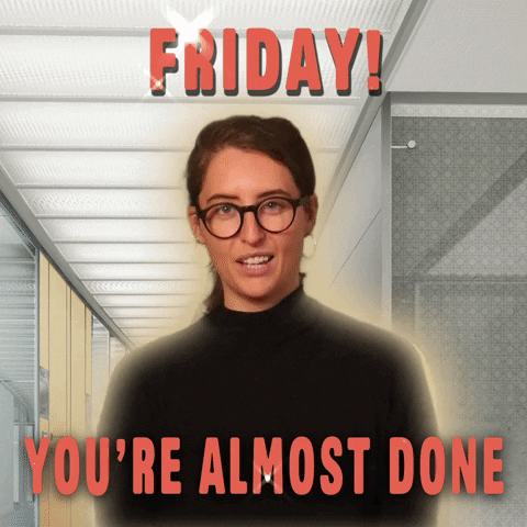 Video gif. A woman in a black turtleneck standing in an office hallway smiles and says, "Friday! You're almost done."