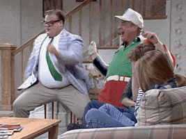 SNL gif. Comedians Chris Farley and Rodney Dangerfield dance in celebration during a motivational speaker skit. 