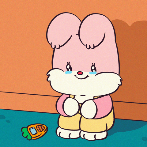 Kawaii gif. Smiling but sad, an adorable pink rabbit cries continuously as she sits on the floor, holding her knees.