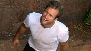 TV gif. Scott Caan as Danno in Hawaii Five-O stands in dirt and looks up, points at himself, draws a heart in the air with his two index fingers, and points up.