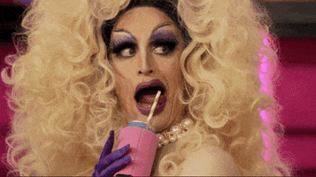 Reality TV gif. In a clip from RuPaul's Drag Race, Lady Camden uses their tongue to move the straw of their drink from one side of their mouth to the other.
