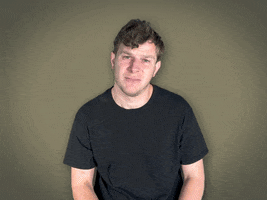 Video gif. Man puts his hands to his chest in a gesture of sincerity and says, "I'm sorry," which appears as text.