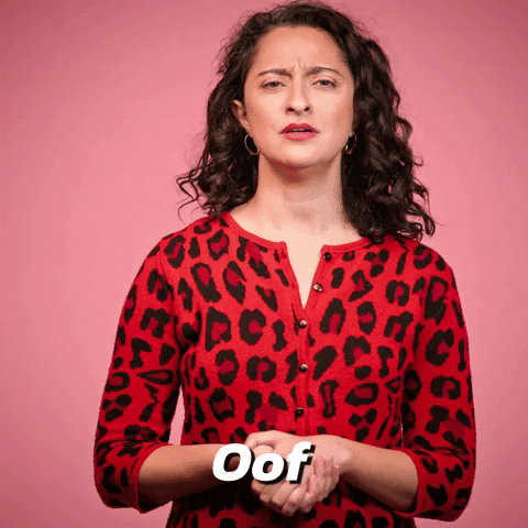 Video gif. A woman shrugs and winces as if seeing something she didn't want too. Text, "Oof"
